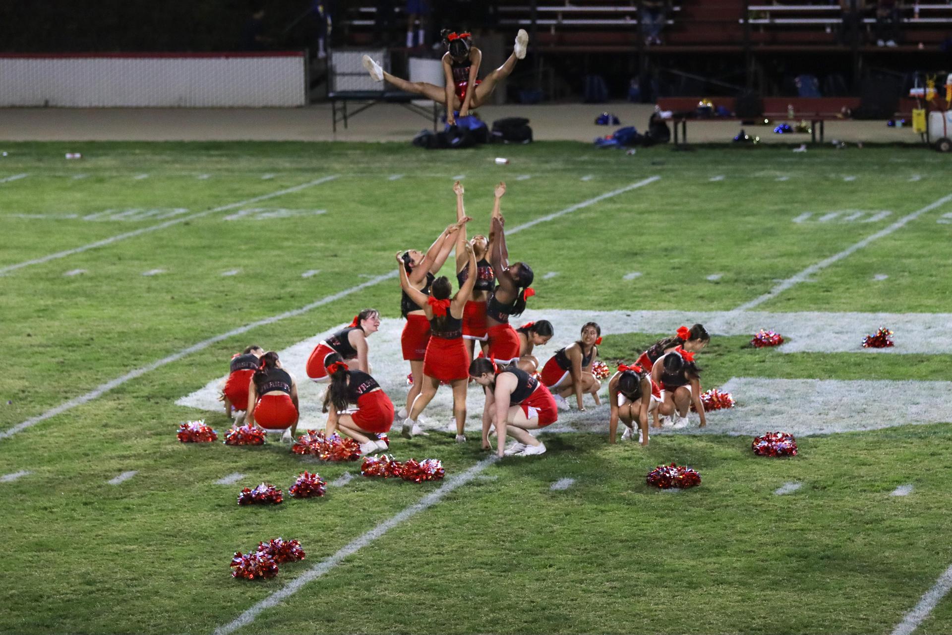 Varsity girls cheering at the Parlier football game