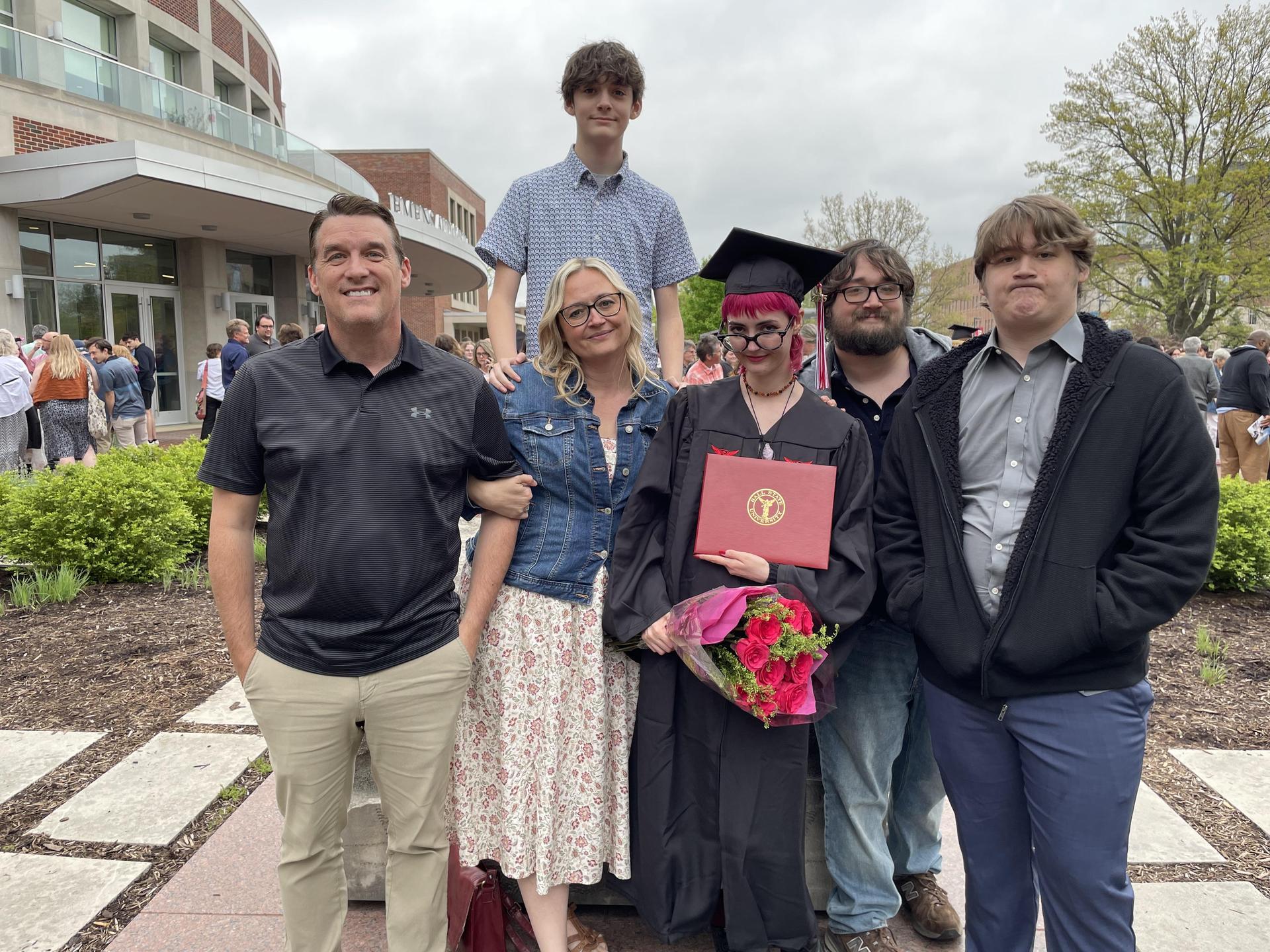 Mr. Davenport, Mrs. Davenport and her four kids at her daughter’s graduation.