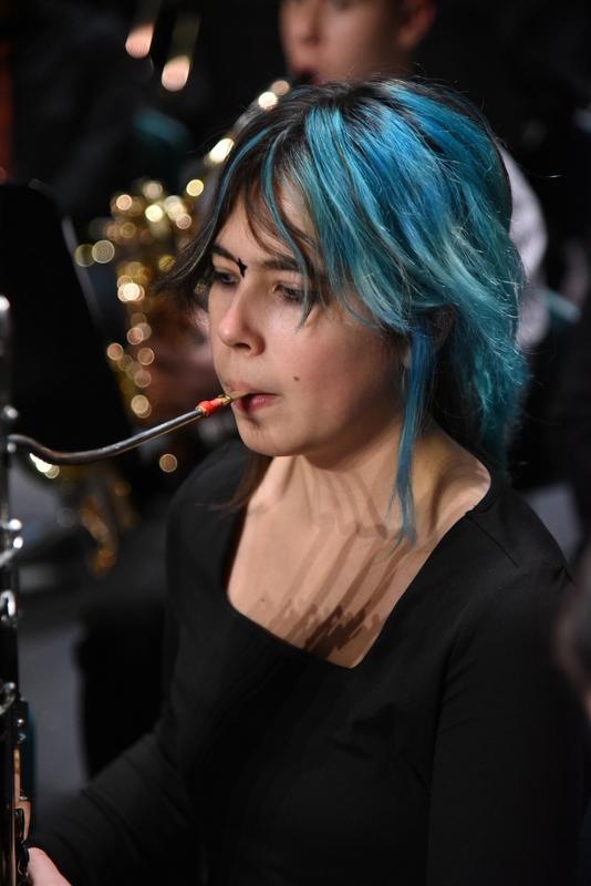 Student playing an instrument