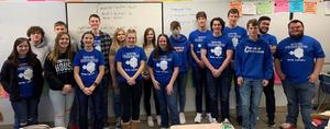 17 students in blue shirts
