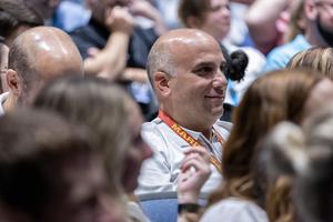 A teacher laughs during the gathering