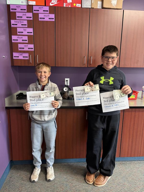 Students showing off their awards.