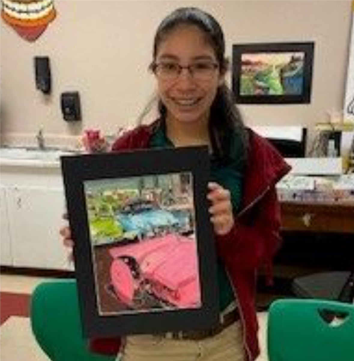 Resaca Student holding their painting