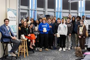 Clare Beams poses with students after their chat