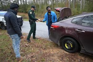 A Pike County Sheriff’s Office deputy stopped to assist Pike County citizens who were changing a flat tire