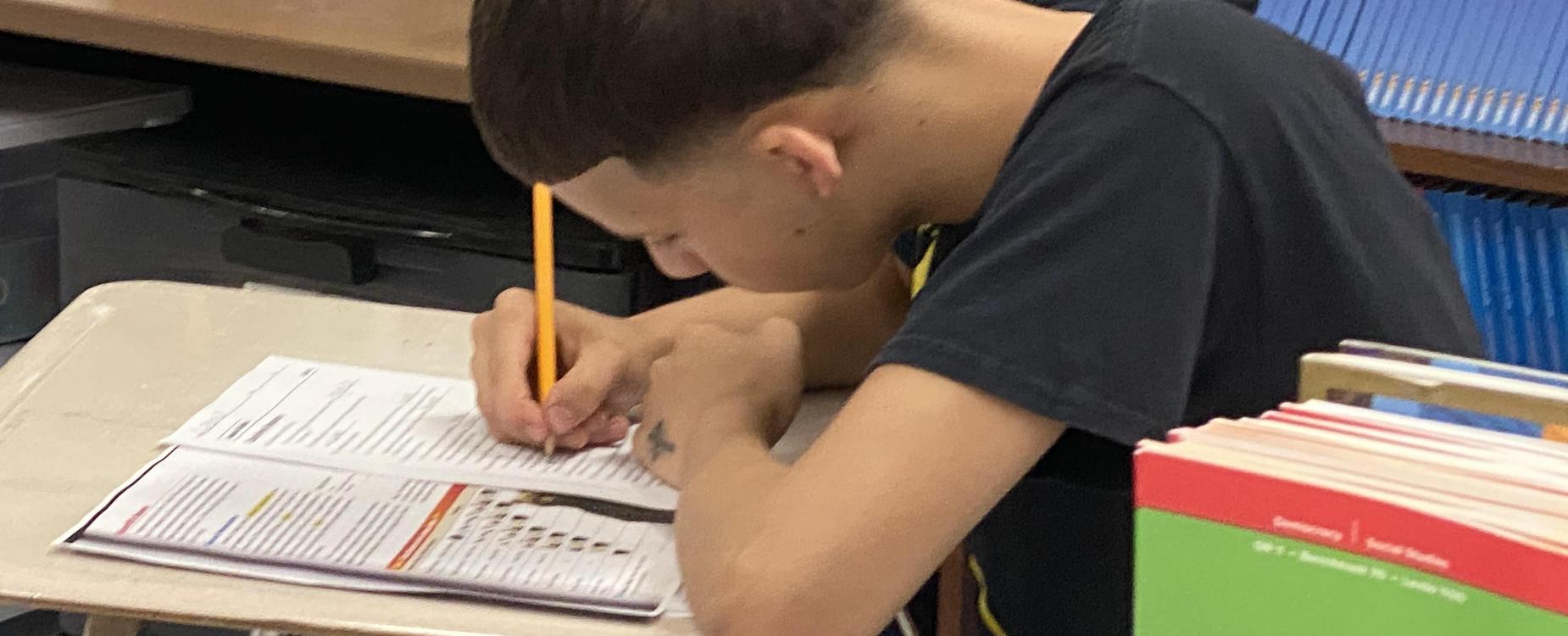 A student works on an assignment in class at Southbridge Academy