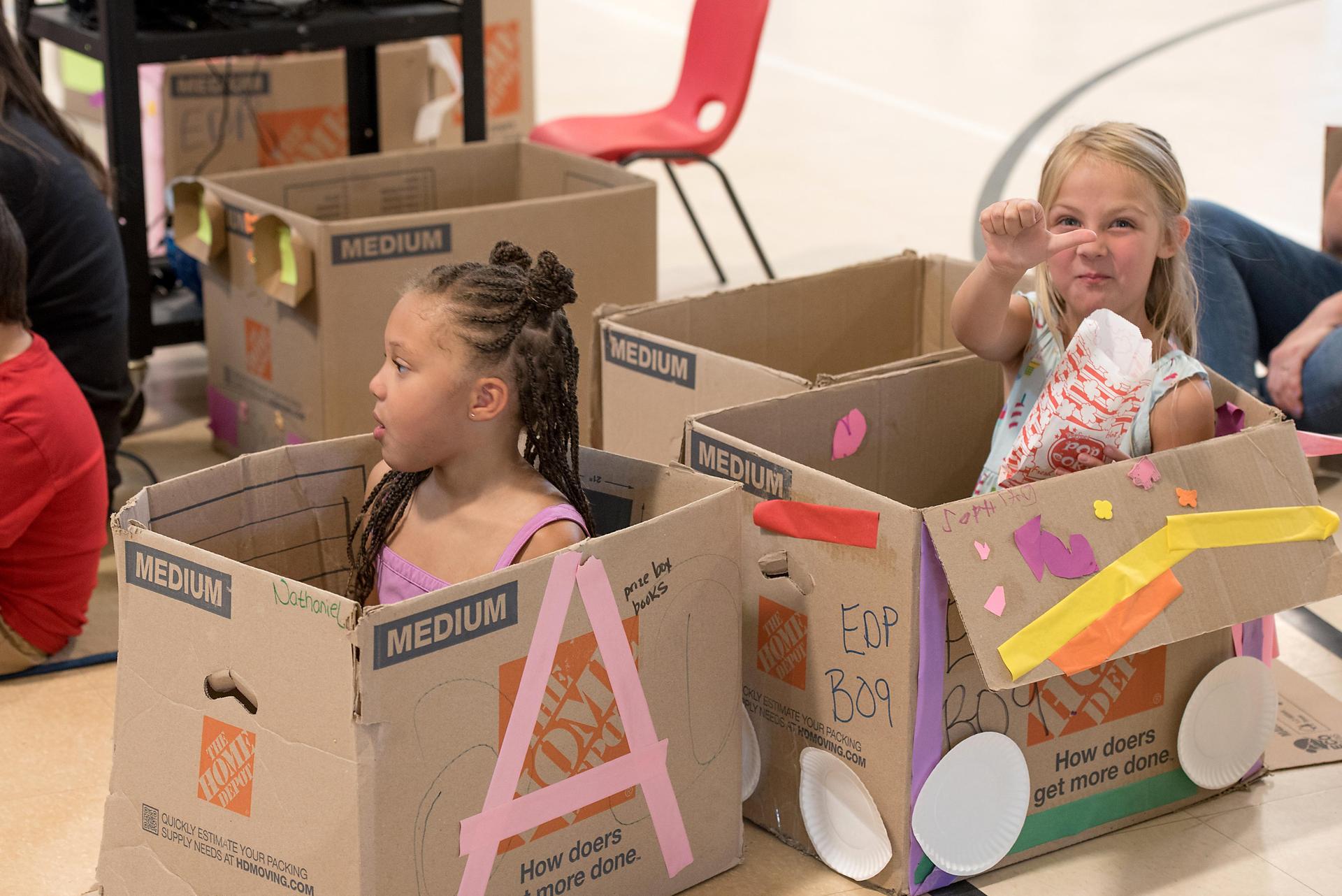 students watching a movie in cardboard cars