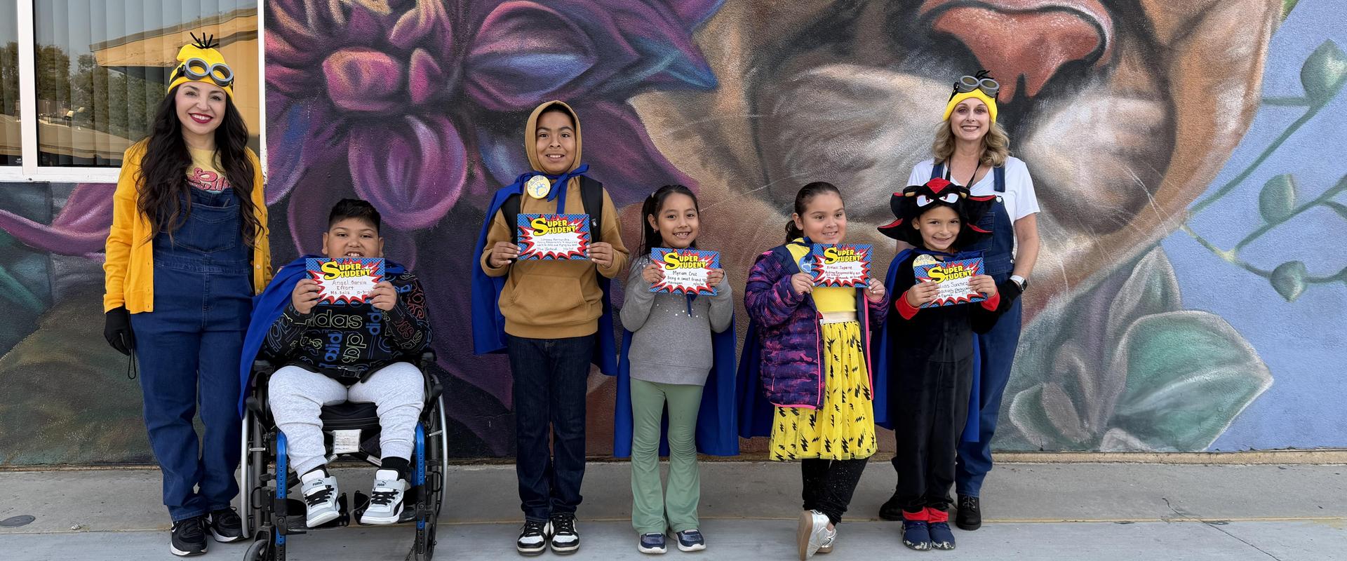 Super students with principal and vice principal