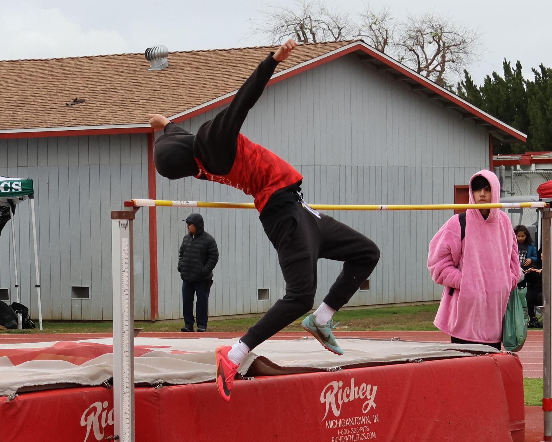varsity boys high jumping