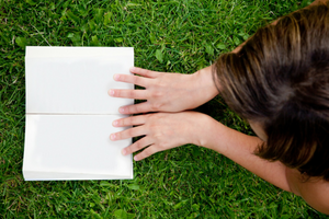 girl reading in grass