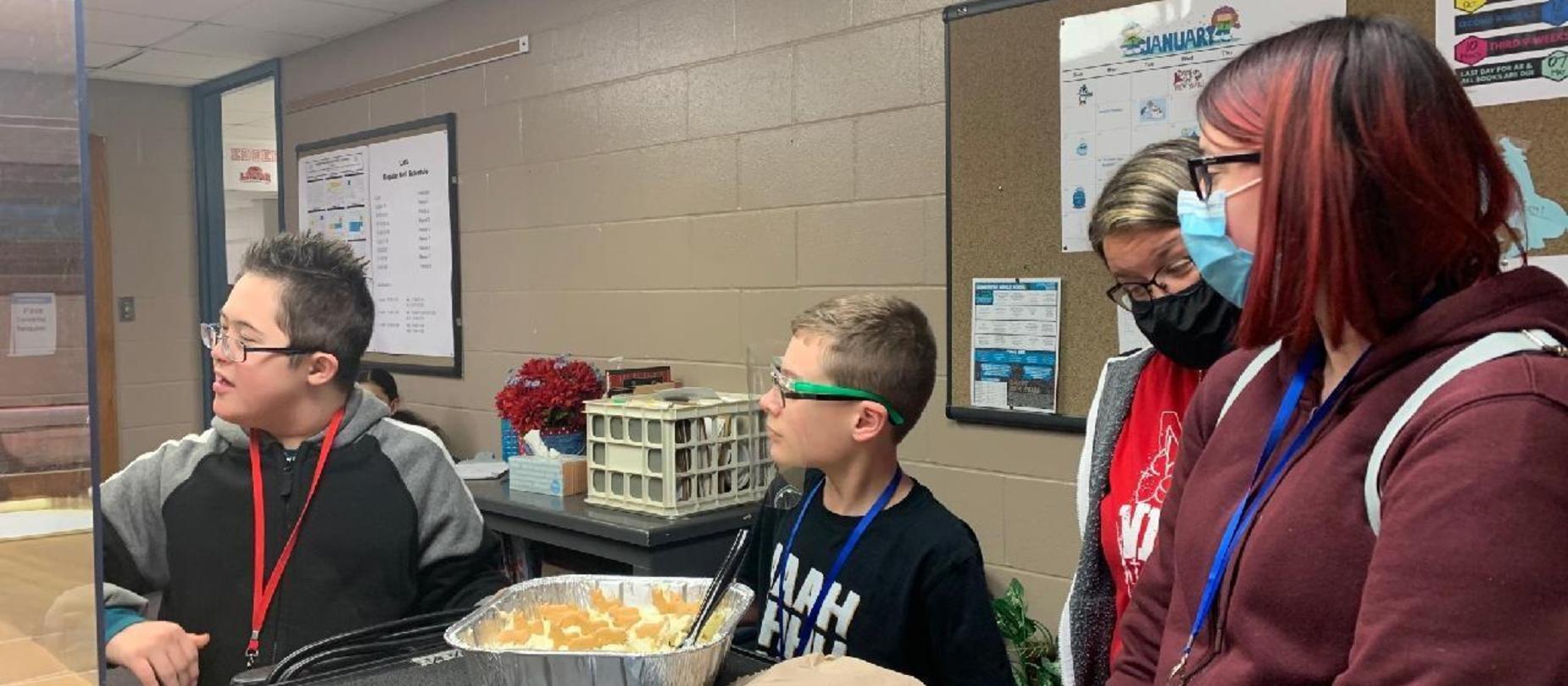 Students use food to learning measuring skills.