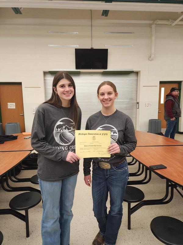 Two FFA students show their certificate in the demonstration contest.