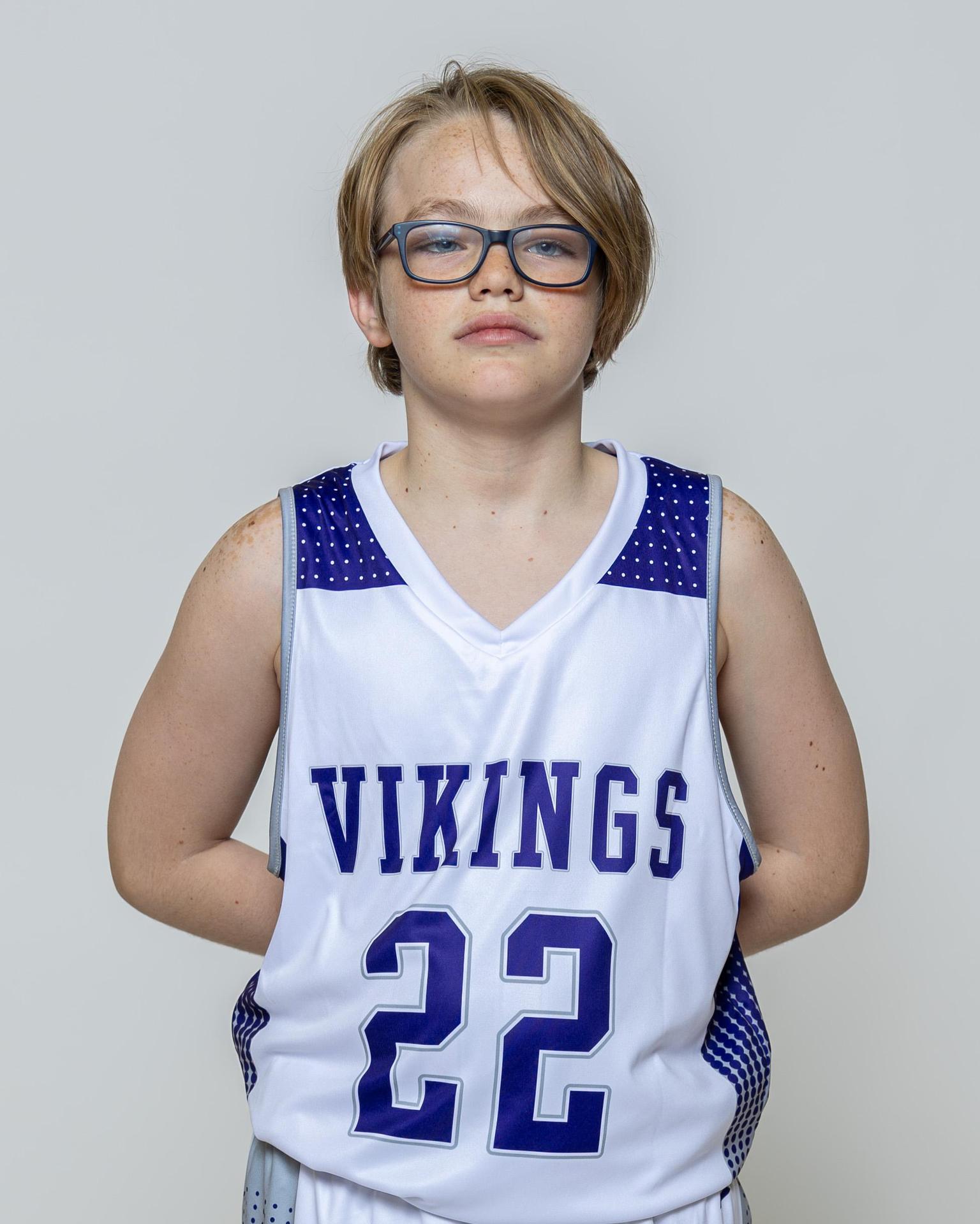 Male player number 22 posing with serious stature for a picture