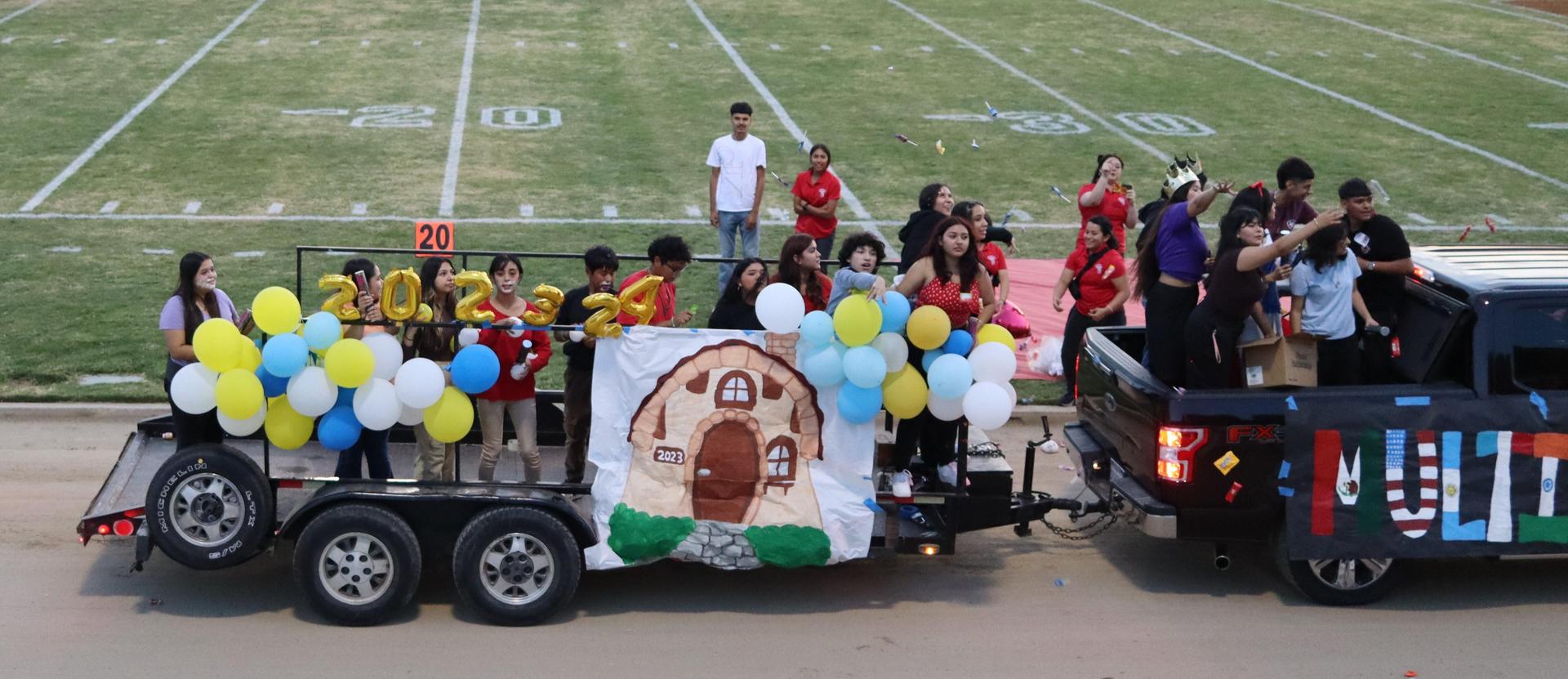 students, staff, and community members enjoying Friday night at the football game