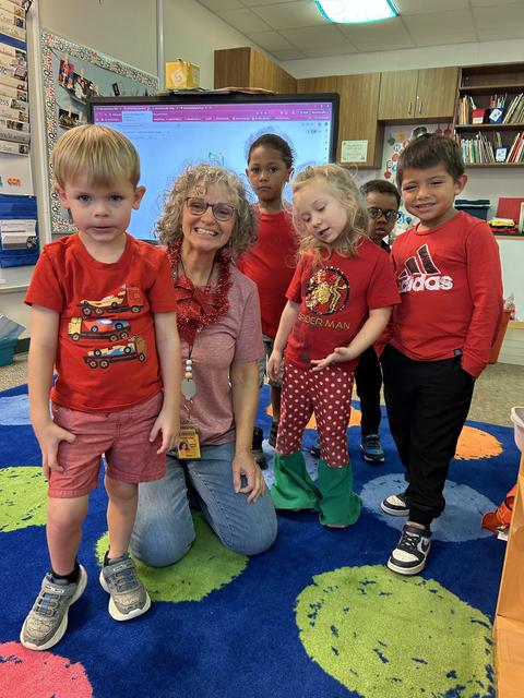 Students and a teacher in a group photo