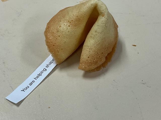 Fortune cookie with a motivational message inside.