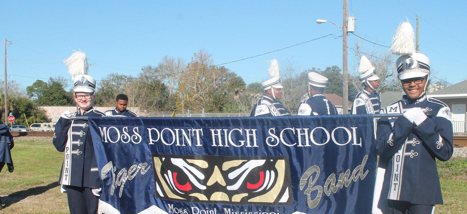 Band members holding a banner