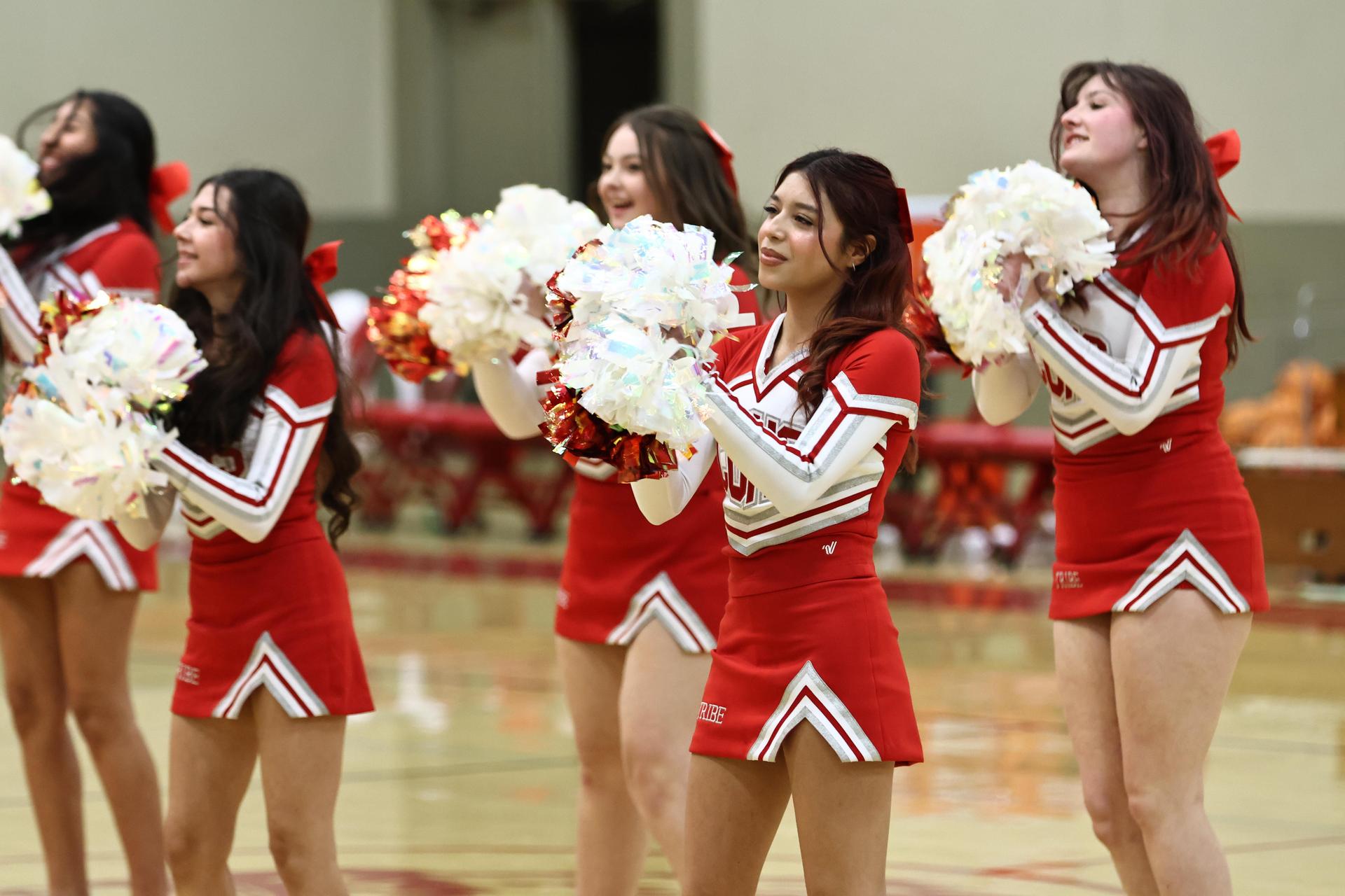 Varsity boys playing basketball against yosemite
