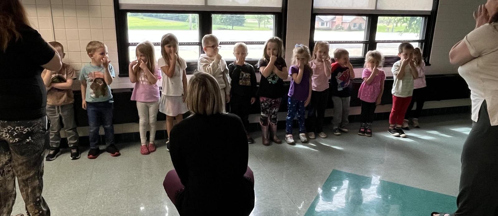 PreK Students paying Simon Says - Touch your nose.