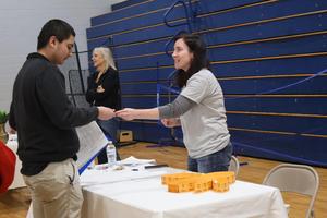 A students talks with Michelle Dwyer, Franklin First CEO, at the Reality Fair