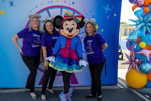 Minnie Mouse with staff at 70 Happiest Hours event