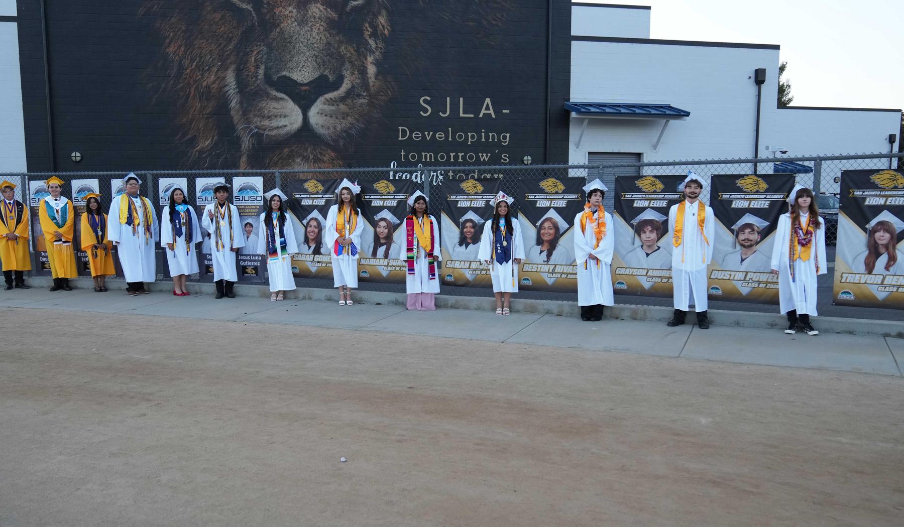 SJLA Top graduate with their personalized banner