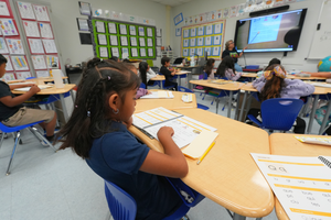 Tracy Dual Language 1st Grader Reads Book