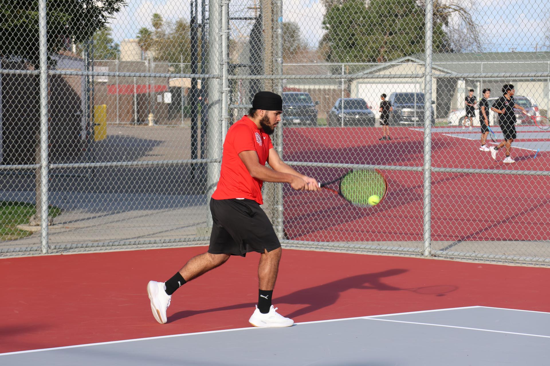 CUHS Boys playing tennis against coalinga
