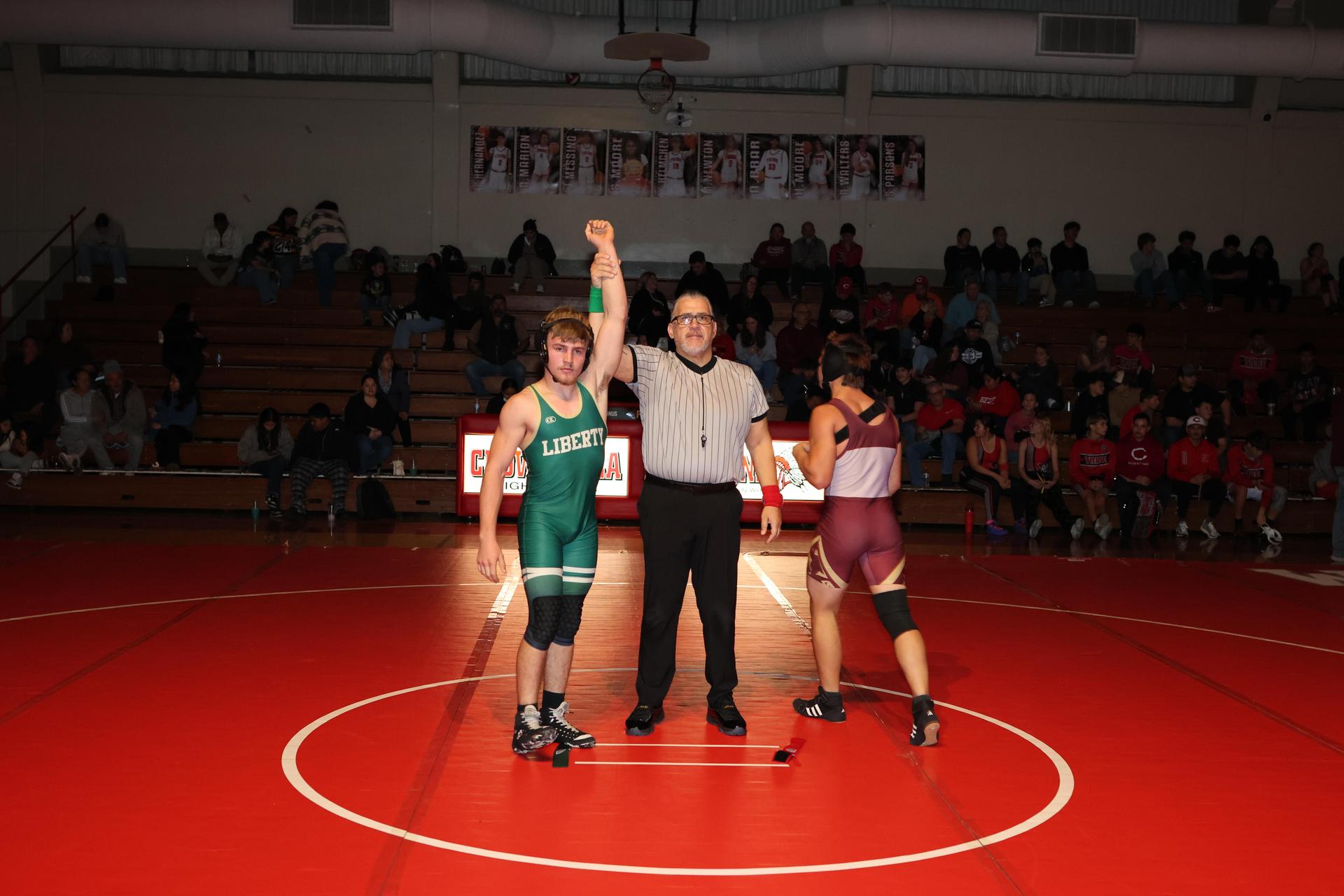Wrestling winners with hands up 71