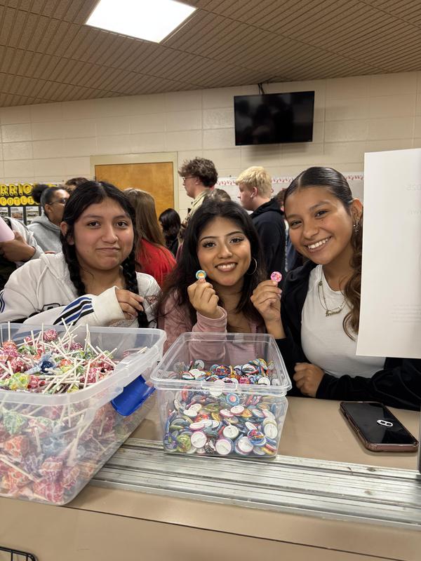 Three students getting dumdums