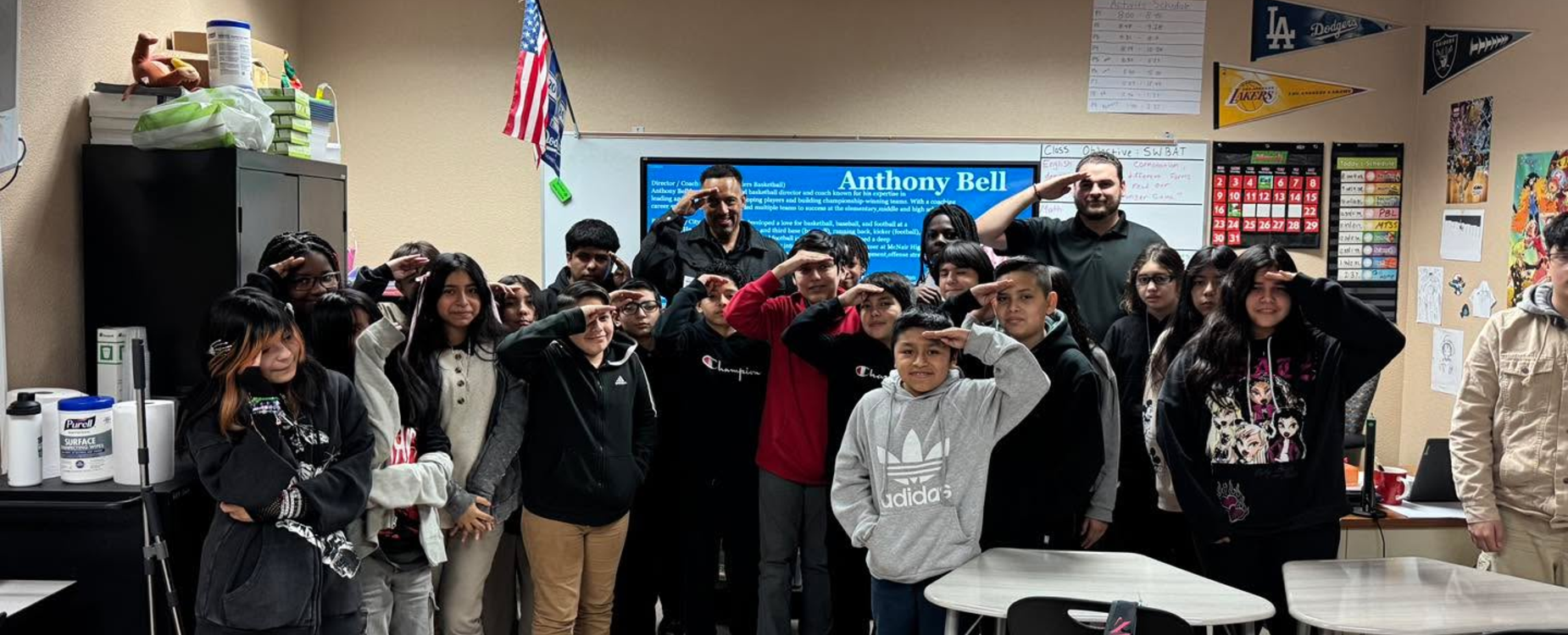 a classroom of students and teachers saluting