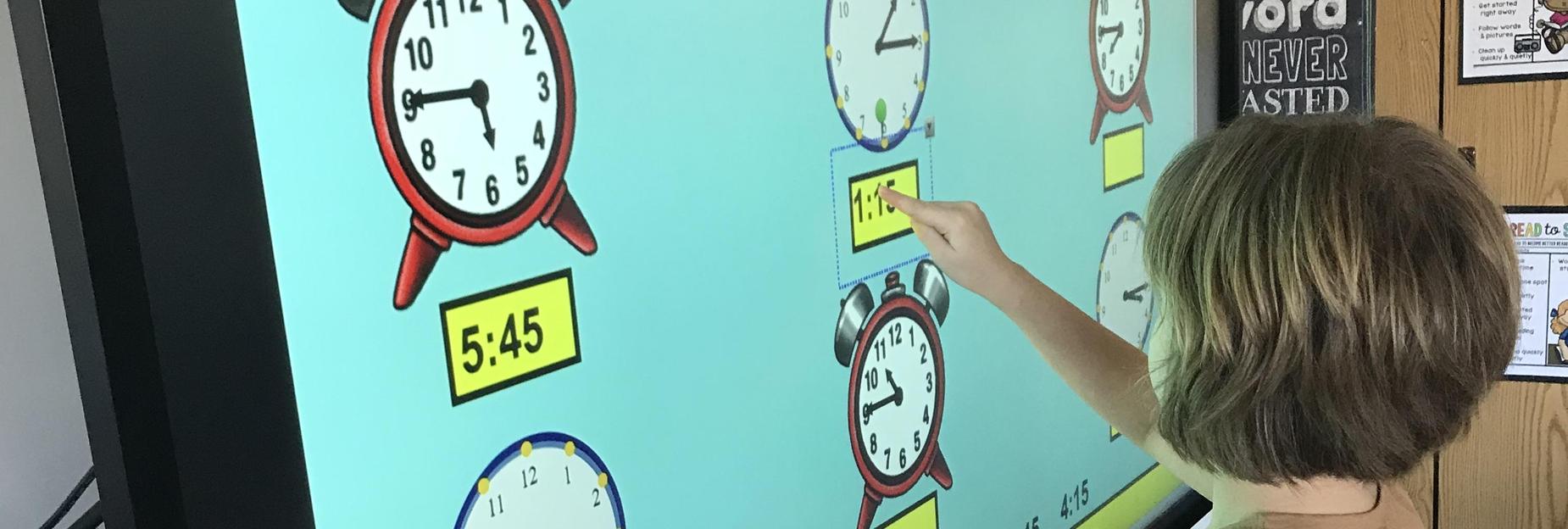 Working on the smartboard in class