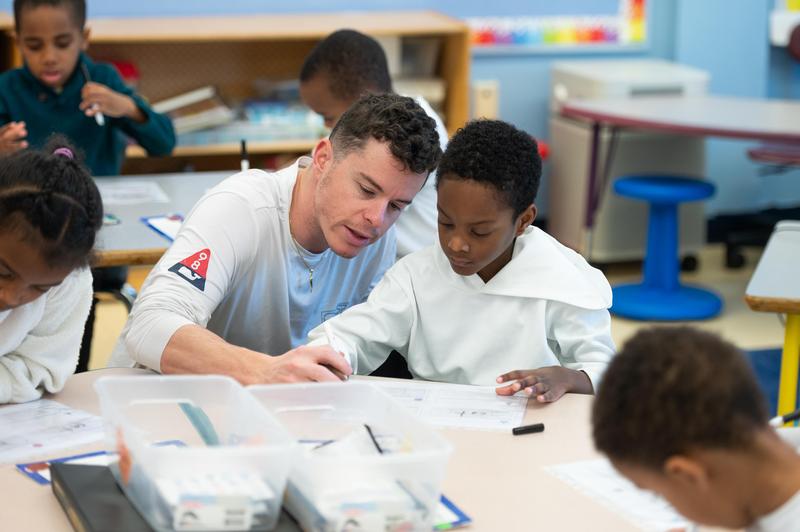 Teacher working with student