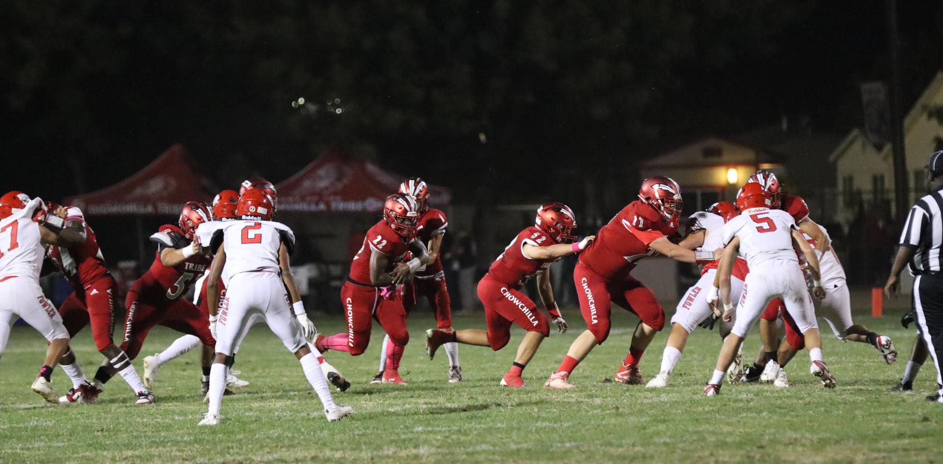 varsity boys playing football against Fowler