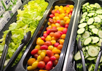 lettuce, red and yellow small tomatoes, sliced cucumbers