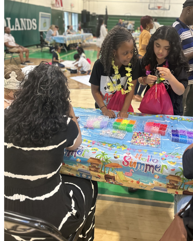 Girls do crafts at table during SELebration