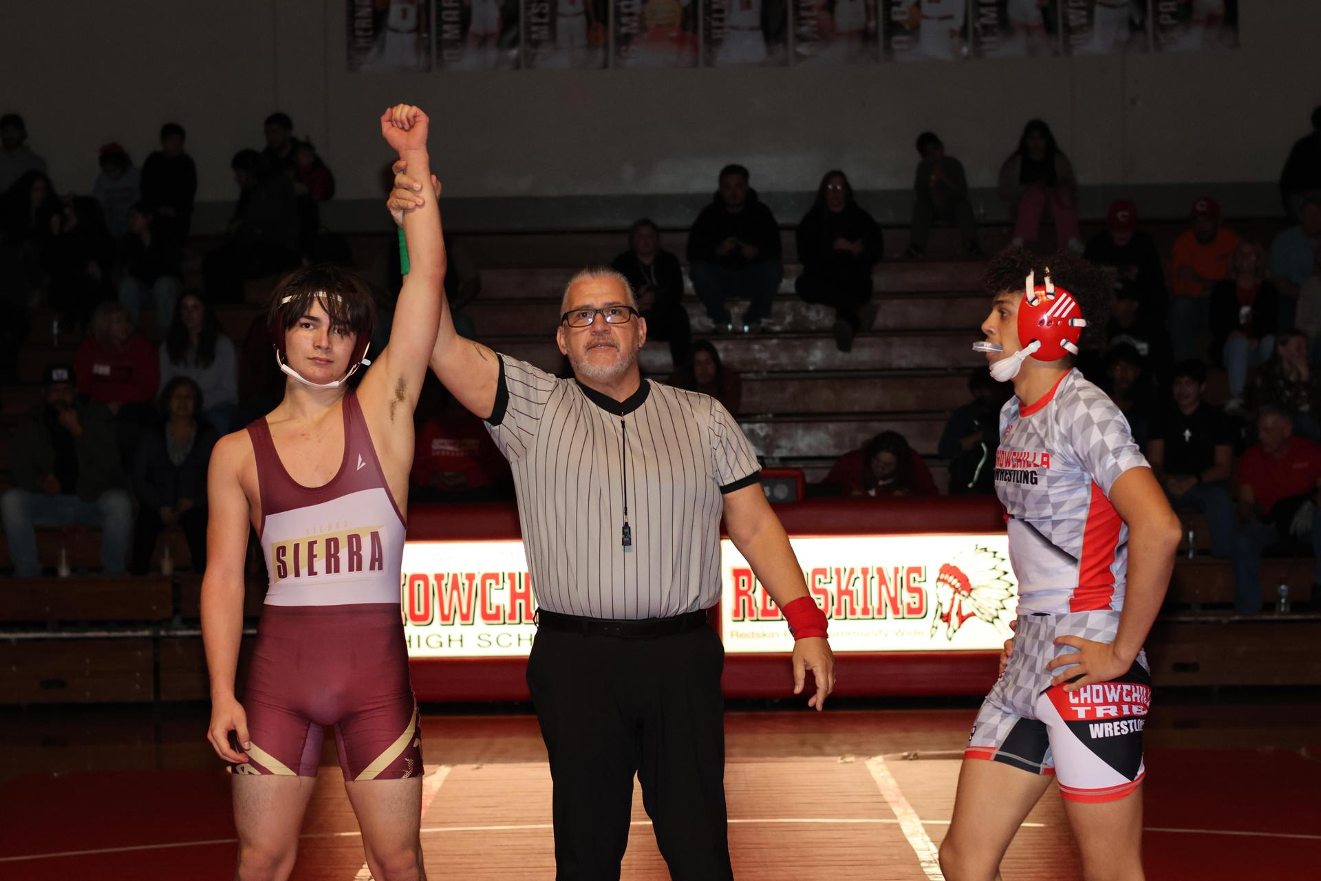 Wrestling winners with hands up 2