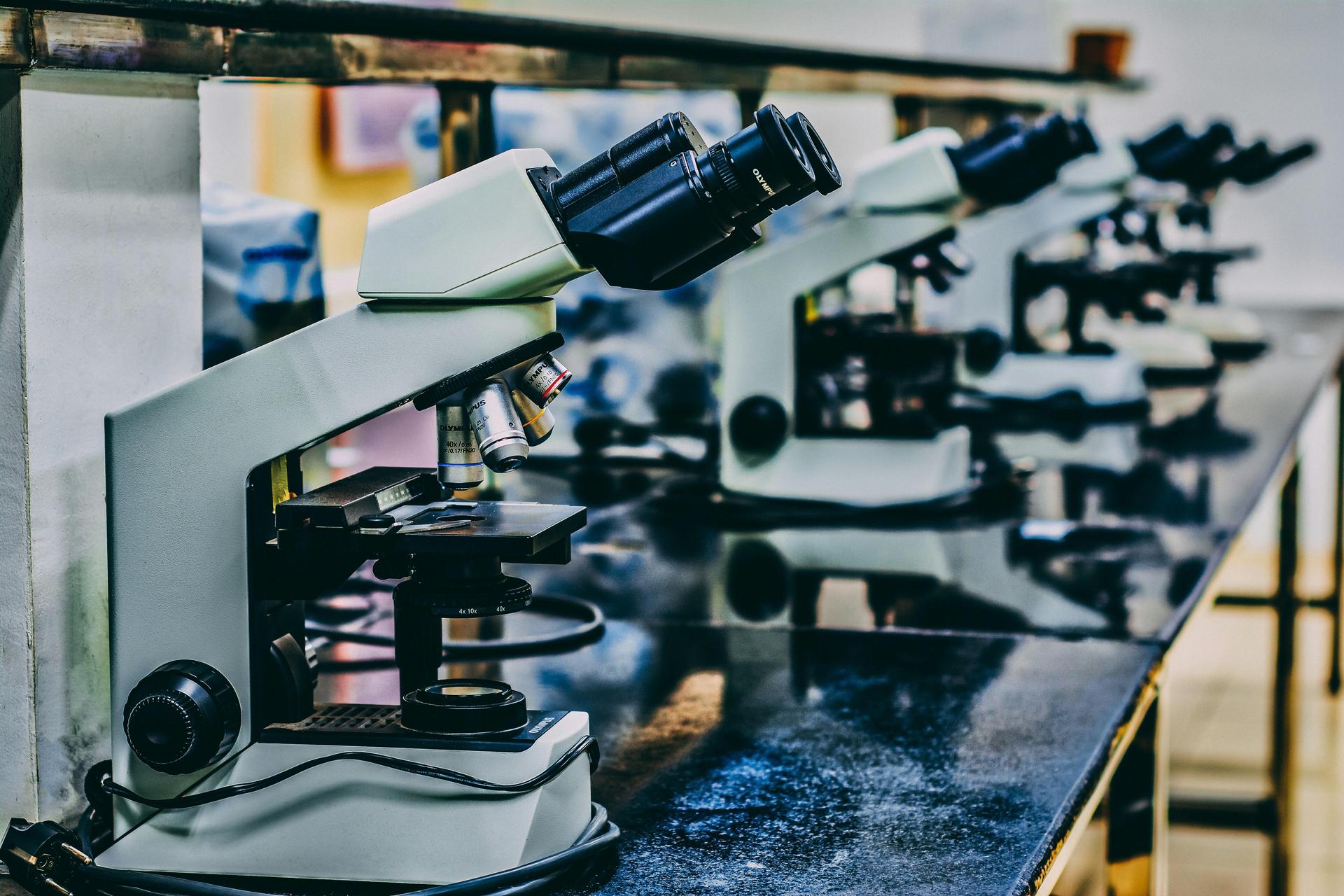 Close-up image of a microscope on a lab table