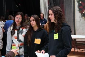 Freshmen girls talk to a tradeswomen about career opportunities