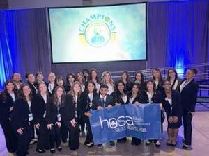 Smiling teens dressed in professional attire