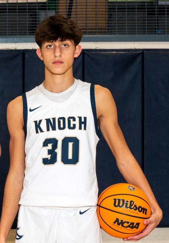 basketball player holding basketball wearing 30 jersey