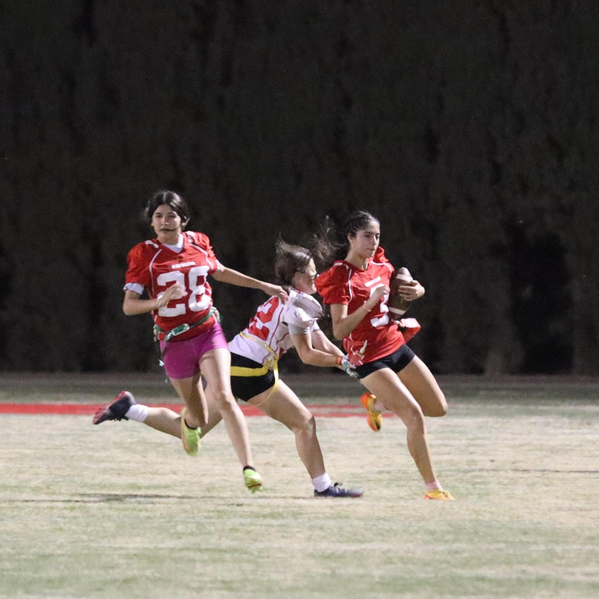 girls playing flag football