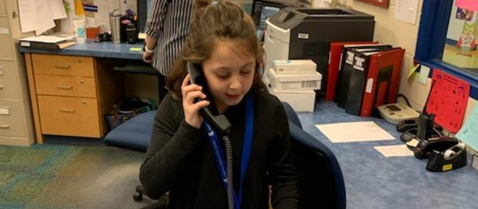 student making announcements