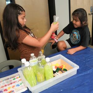 two students work together to make a "squishy"