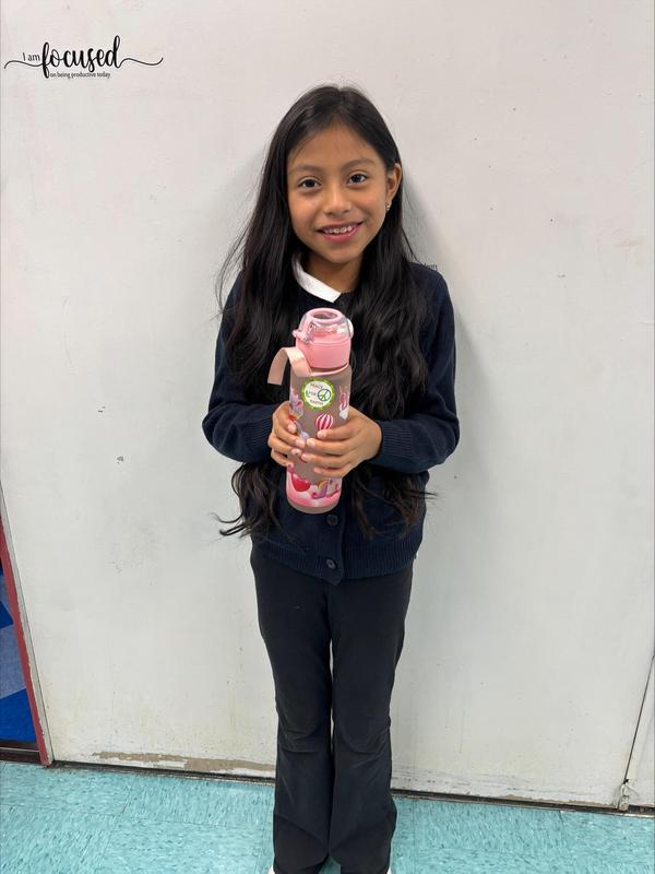 Student with their pink reusable bottle