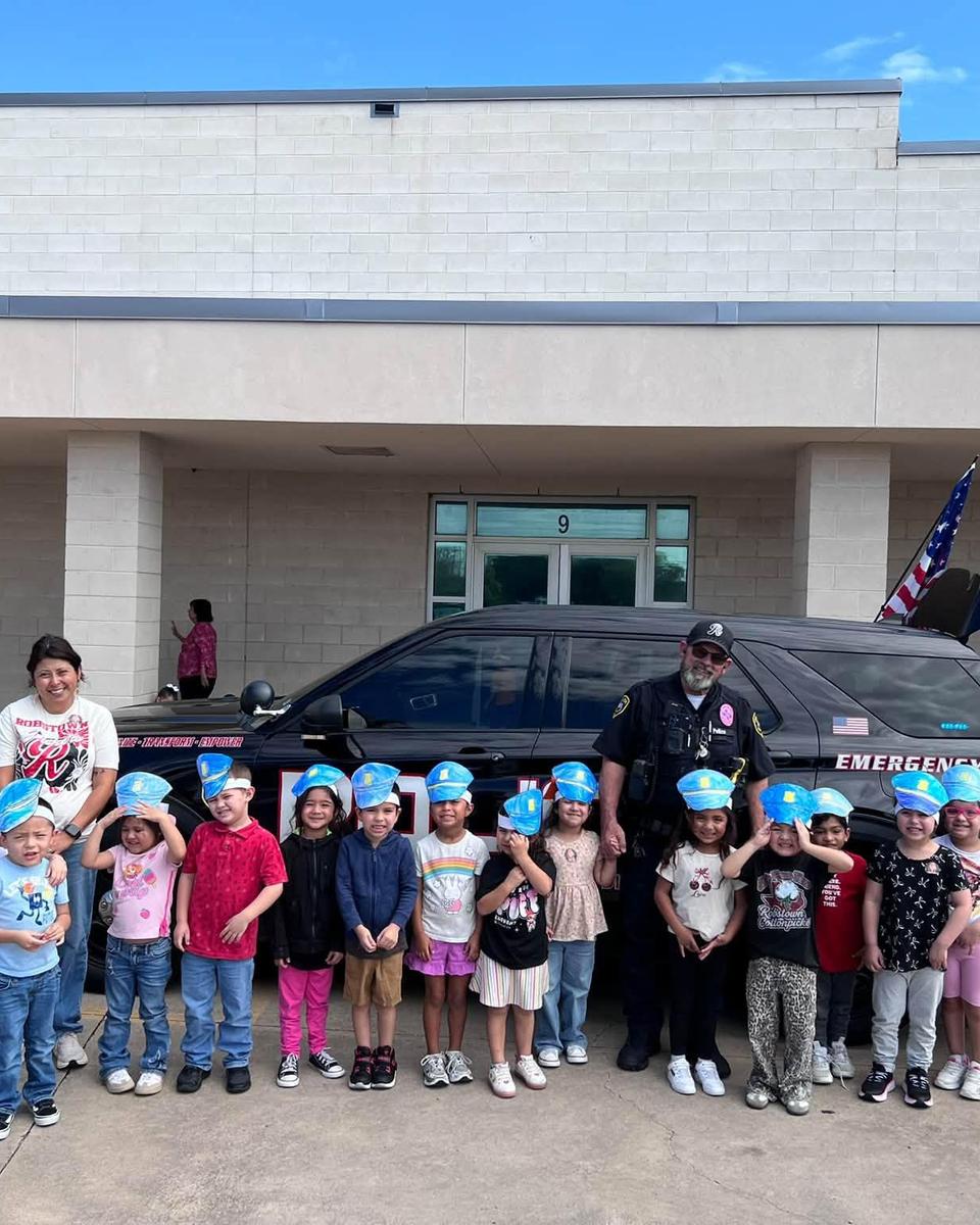 Officer Champion with PK students