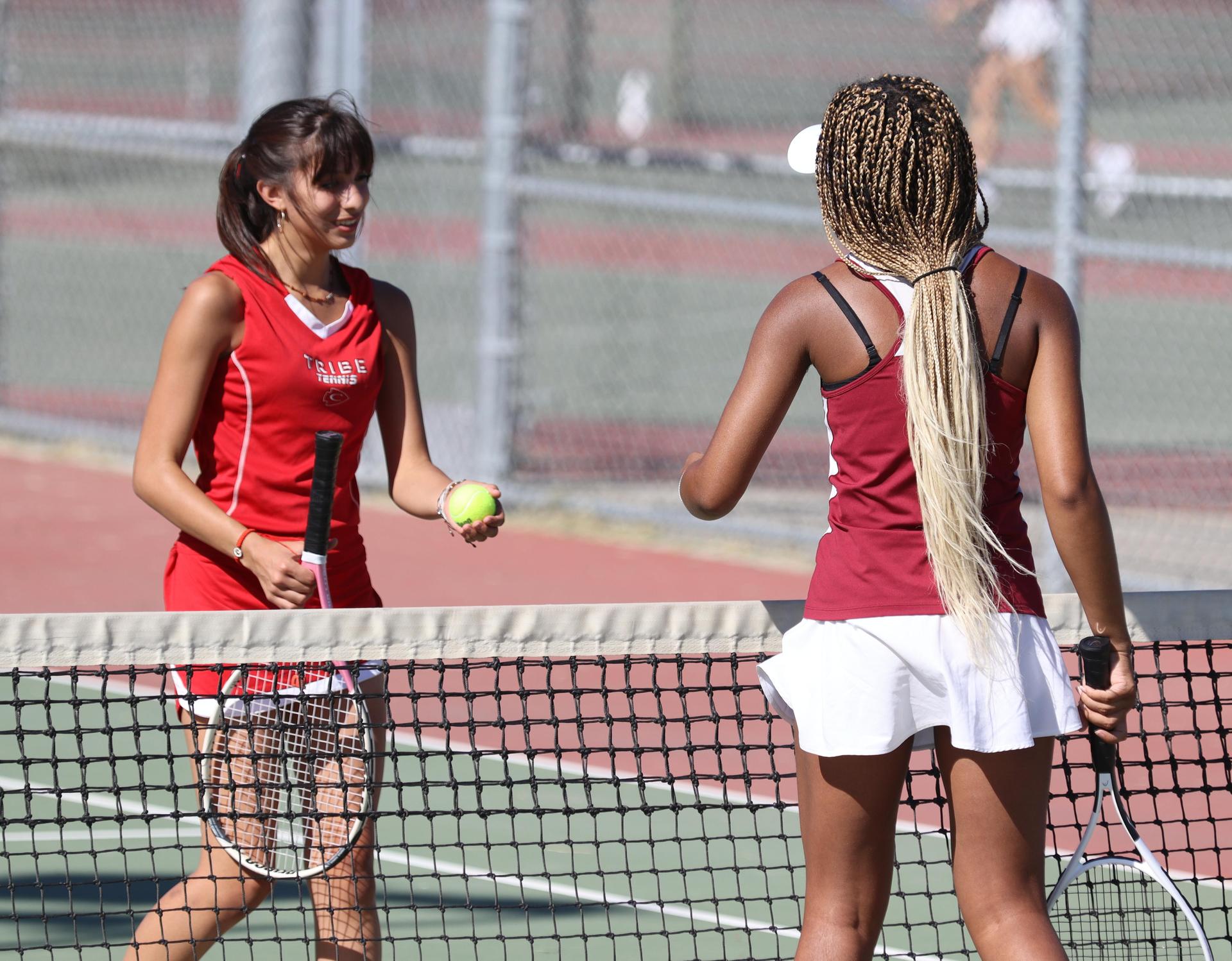 girls playing tennis against Golden Valley