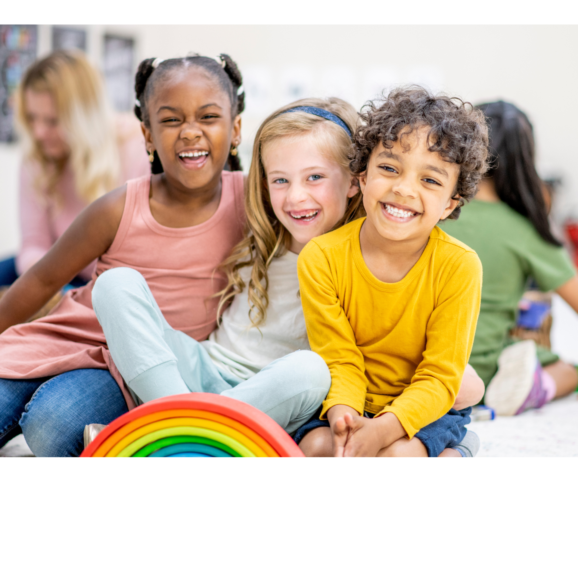 3 students of multiple races laughing