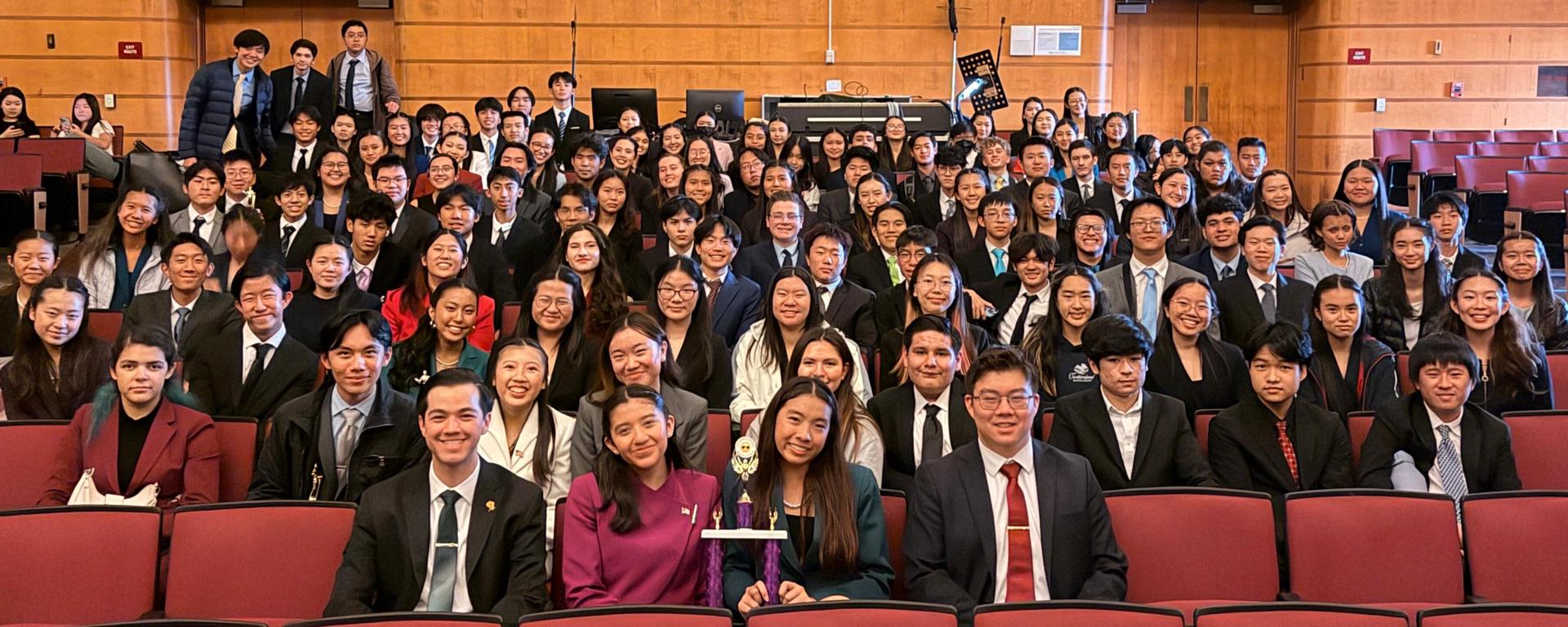 Team sitting in auditorium