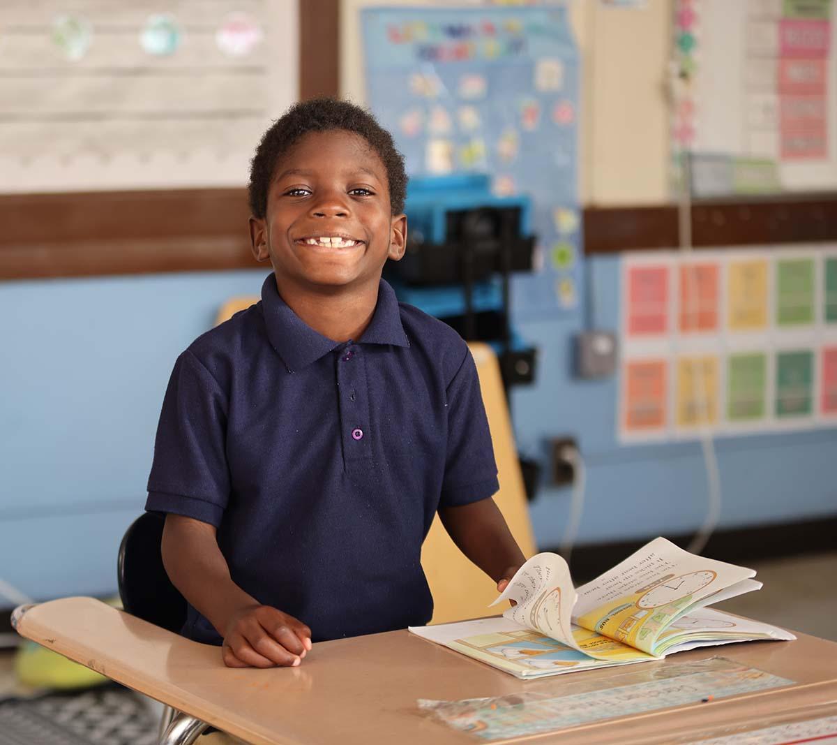 Student working on an assignment in a classroom.